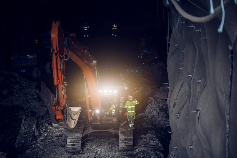 A digger with Infobric Machine connected to it