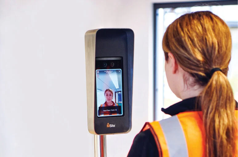 construction worker signing in with face mini device onsite